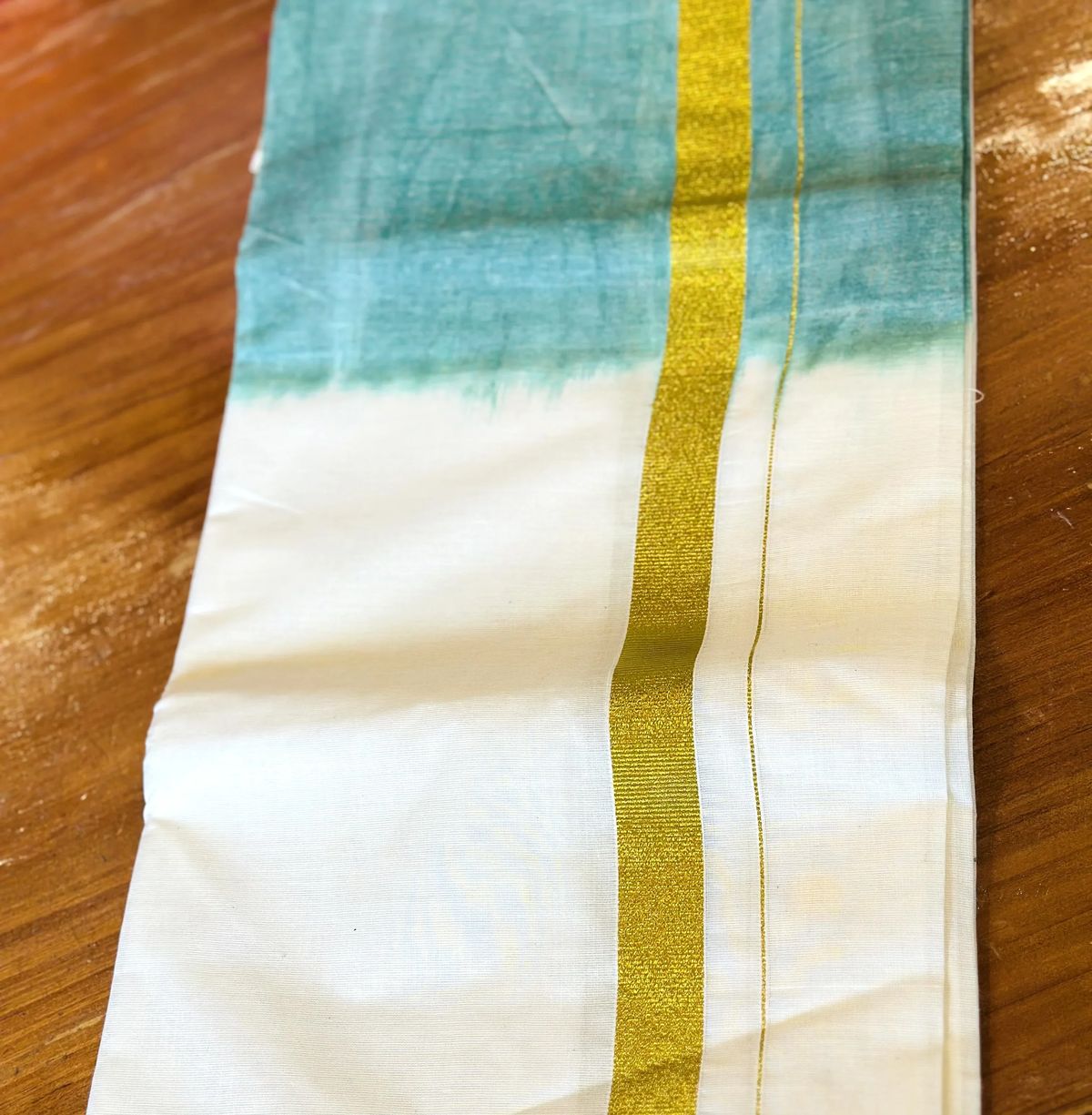 Green Brocade Silk Kurta with Gold Buttons and Cream and Gold White and Teal Mundu - Image 2
