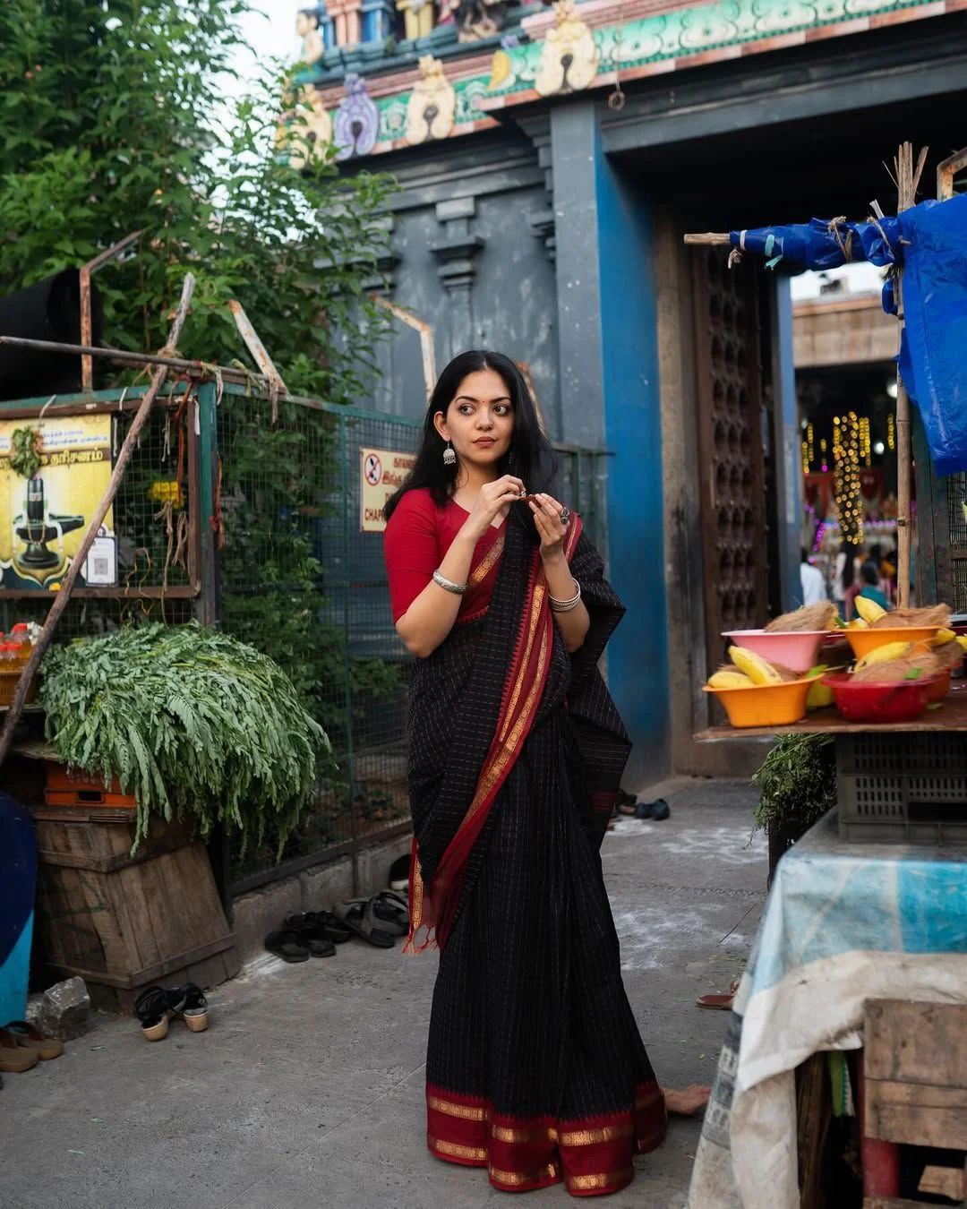Black Saree with a subtle checked pattern and a broad Maroon and Gold Striped Border with Blouse - Image 2