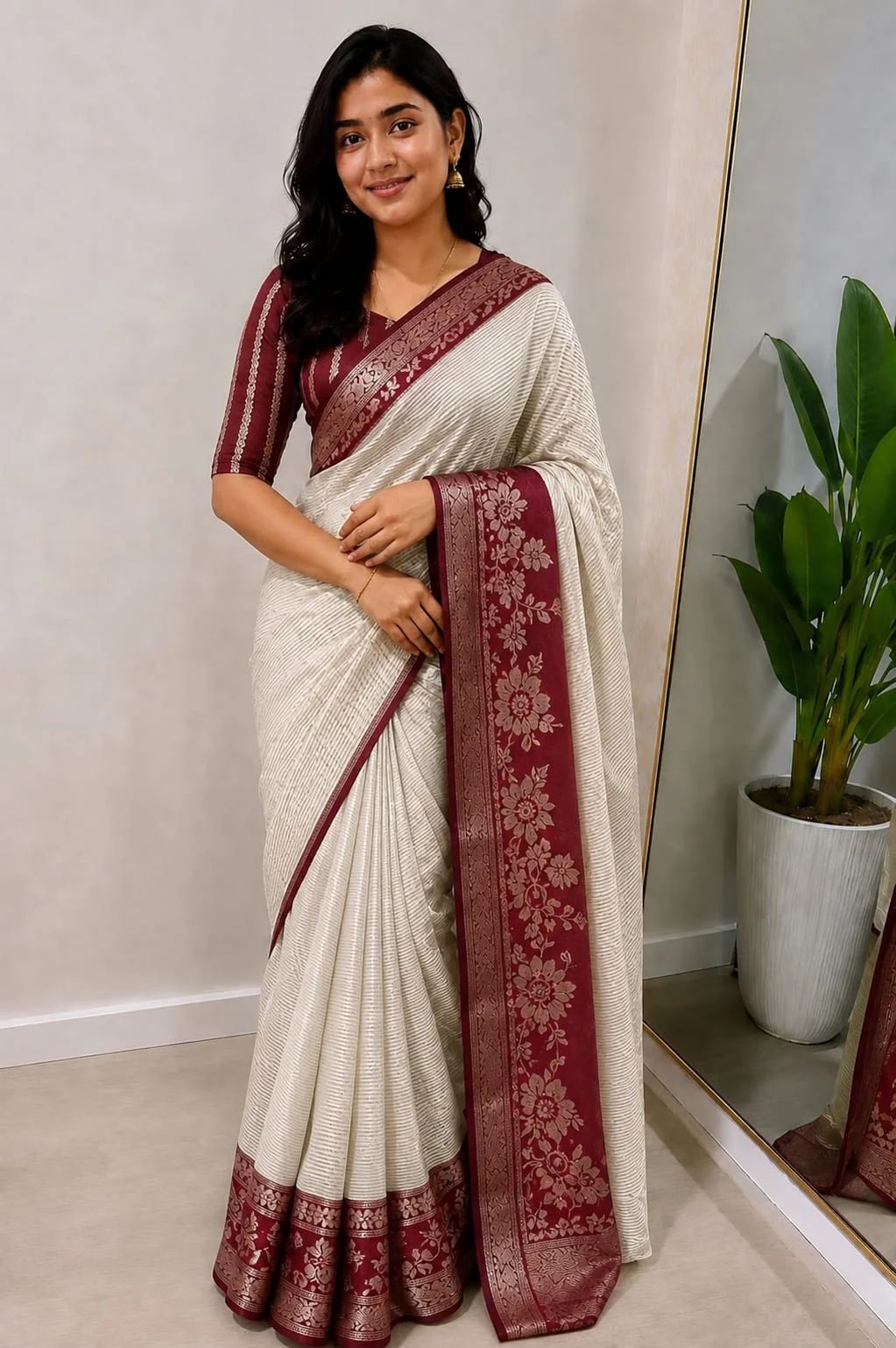 The elegant off white saree