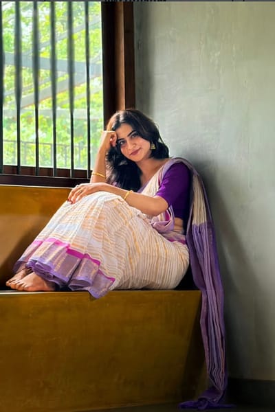 Elegant purple bordered Kerala Mulcotton saree with stripes