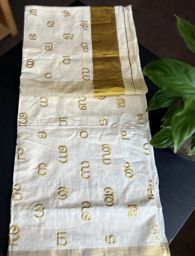 White and Gold Kerala Saree with Malayalam Script Motifs and a Matching Blouse. - Image 4