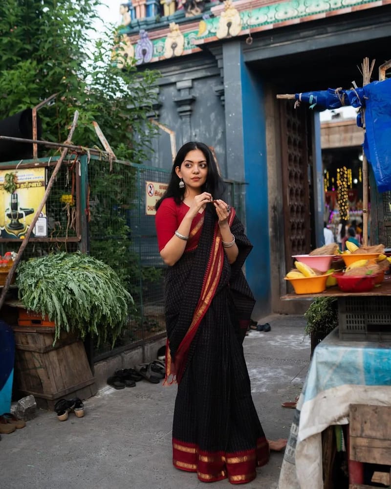 Black Saree with a subtle checked pattern and a broad Maroon and Gold Striped Border with Blouse - Image 2
