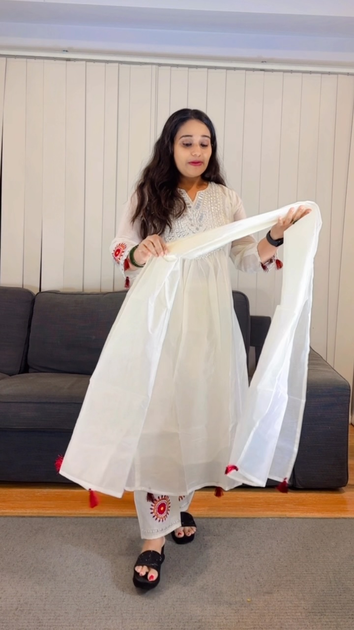 White Anarkali Salwar Suit with Mirror Work Yoke and Red Tassels - Image 3