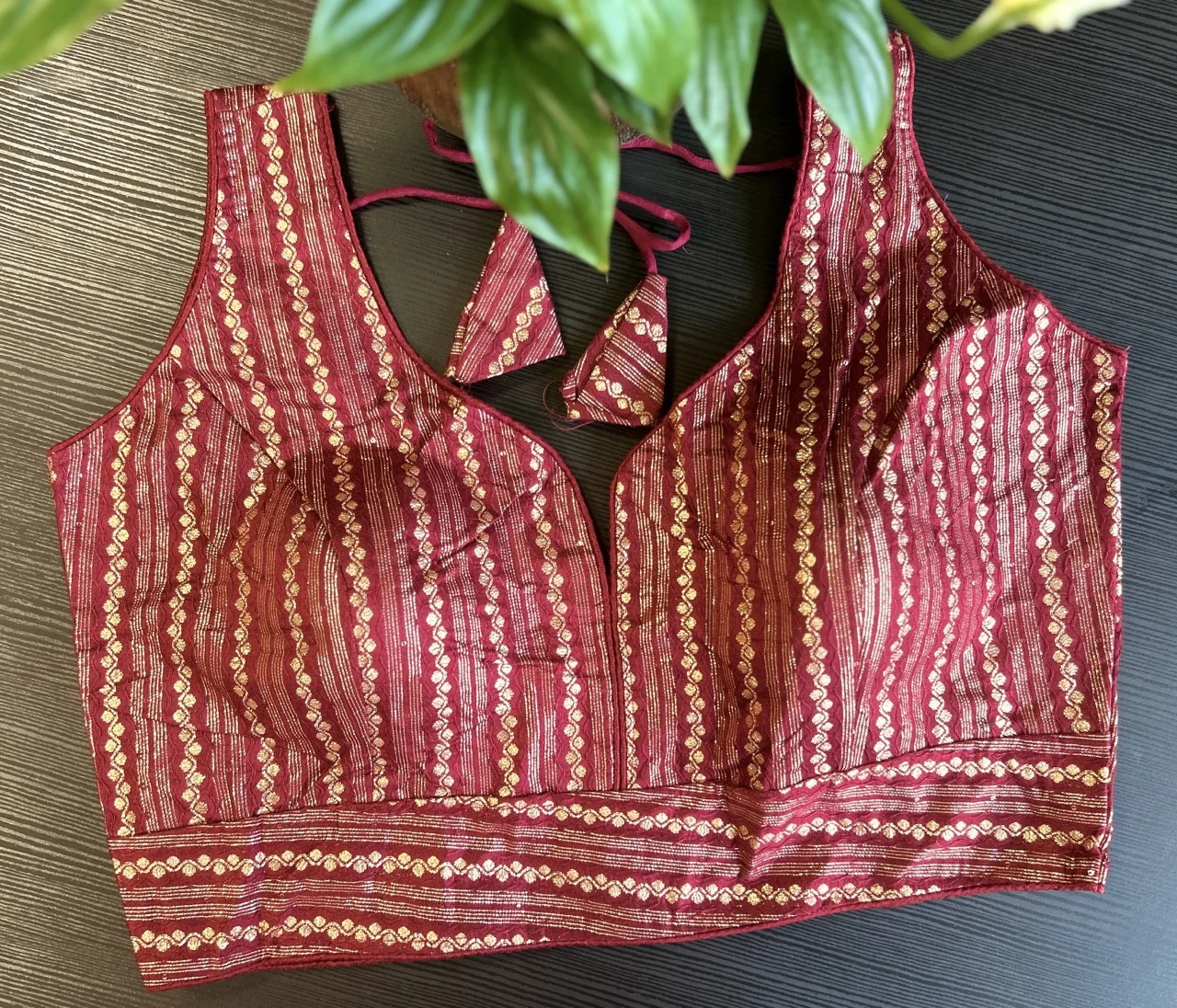 Red and Gold Striped Sleeveless Blouse with Embellished Tassels
