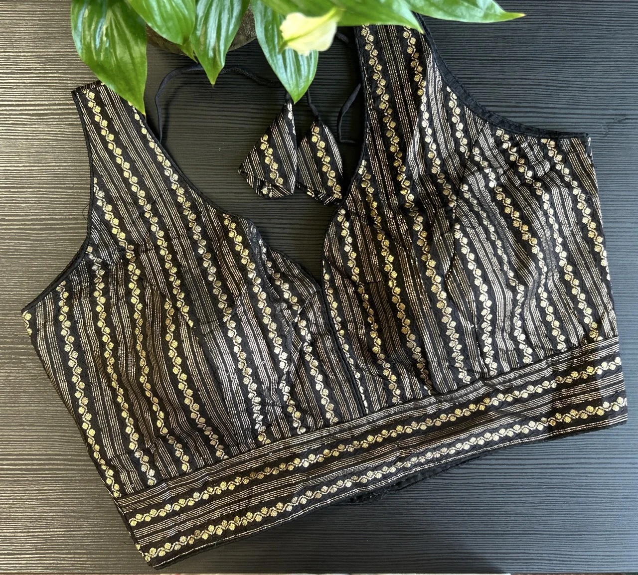 Black and Gold Striped Sleeveless Blouse with Embellished Tassels