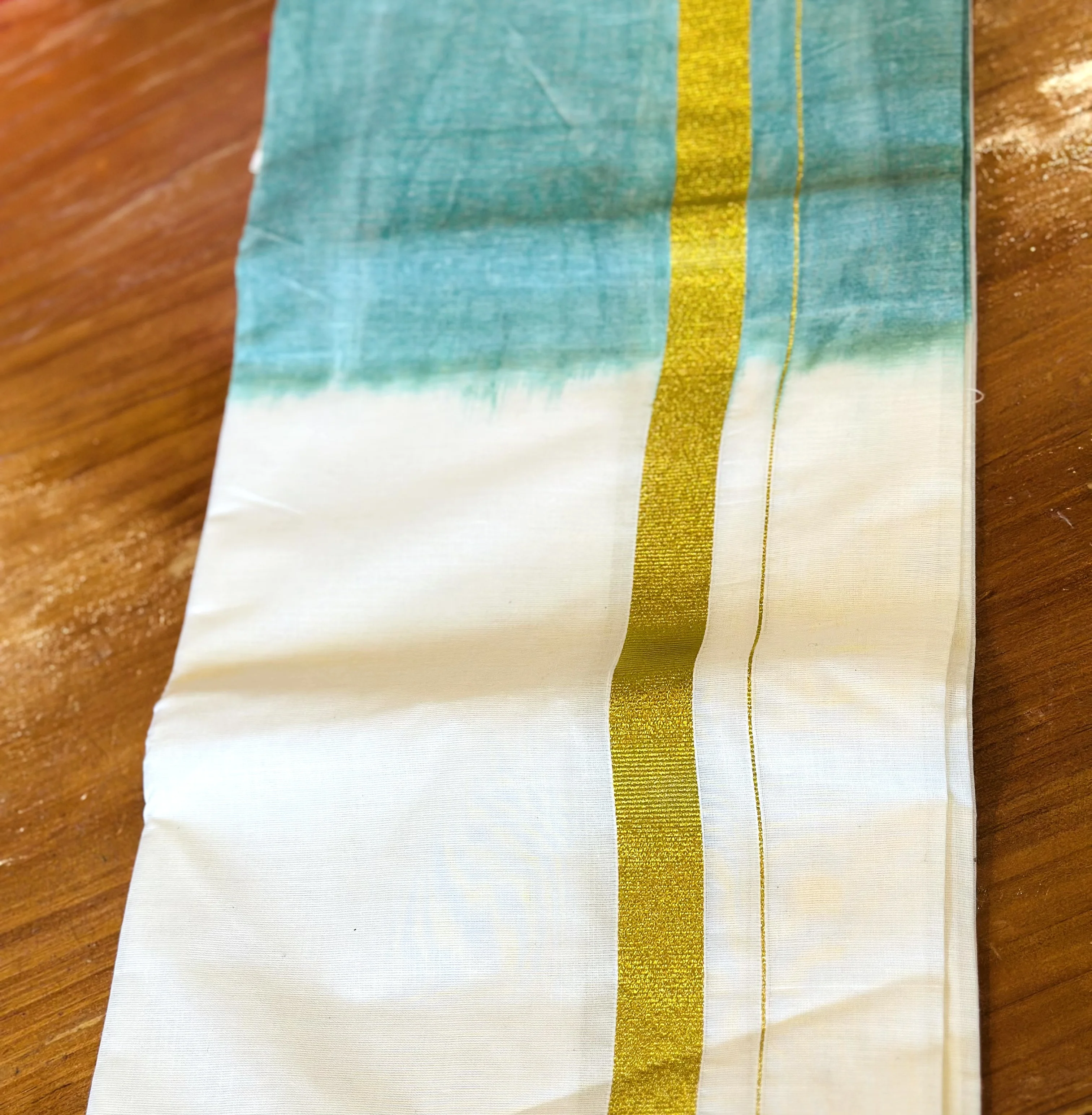 White and Teal Kasavu Mundu with Gold Zari Border
