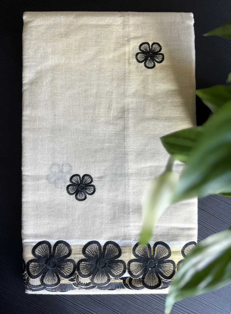 White Kasavu Saree with Black Floral Embroidery and Border