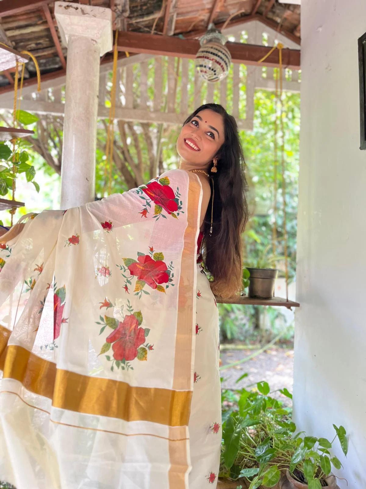 White and Gold Kasavu Saree with Red Floral Hand Painting