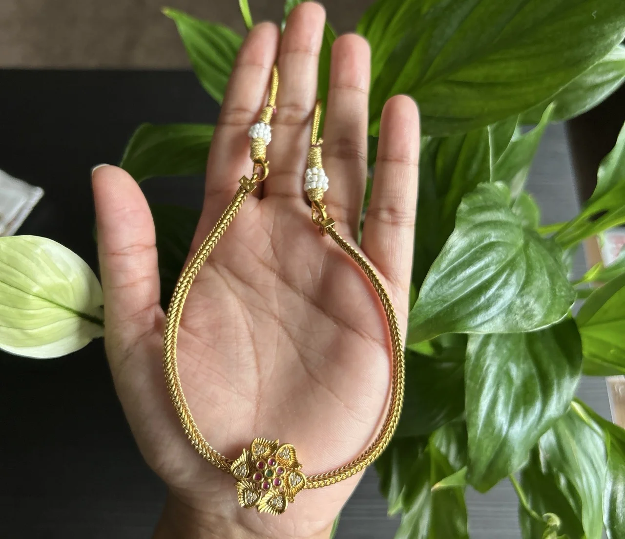 Gold-toned Necklace with Floral Pendant and Matching Stud Earrings - Image 2