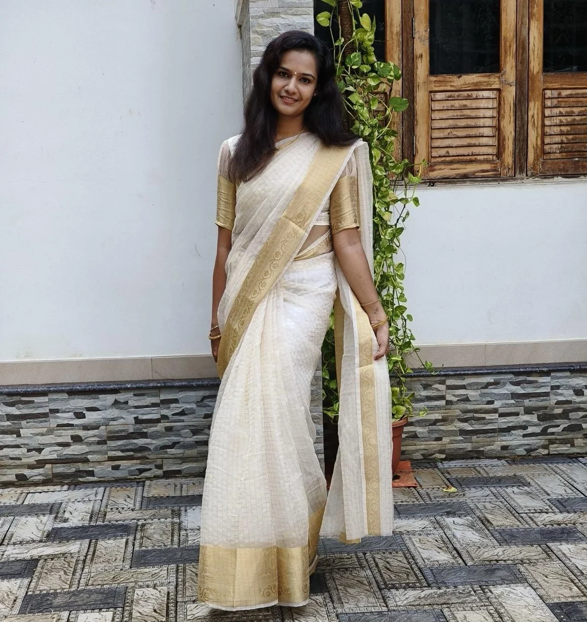 White Kasavu Saree with Gold Border and a Matching Gold Blouse