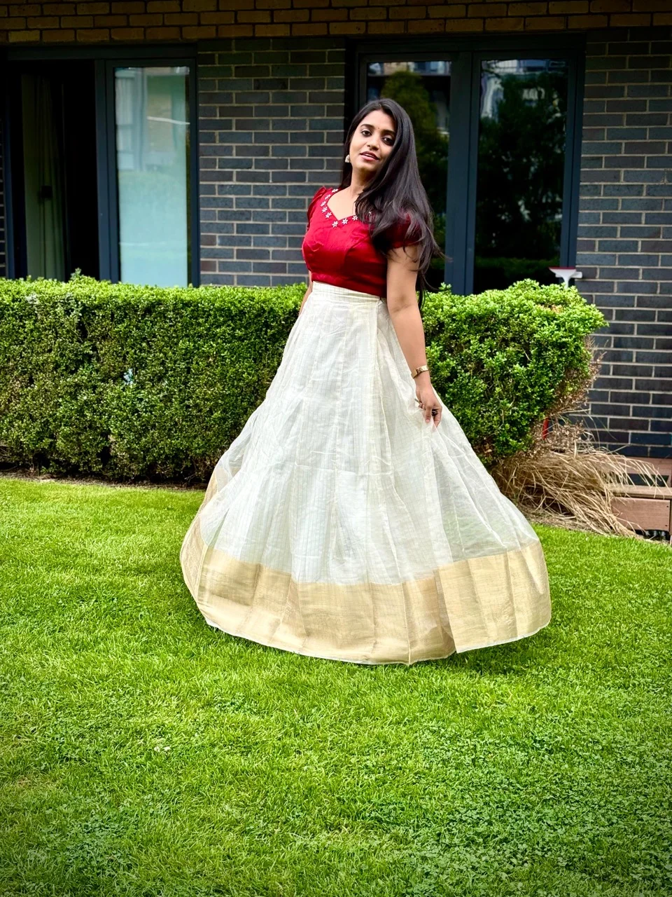  Red Short-Sleeved Blouse with a White and Gold Bordered Skirt