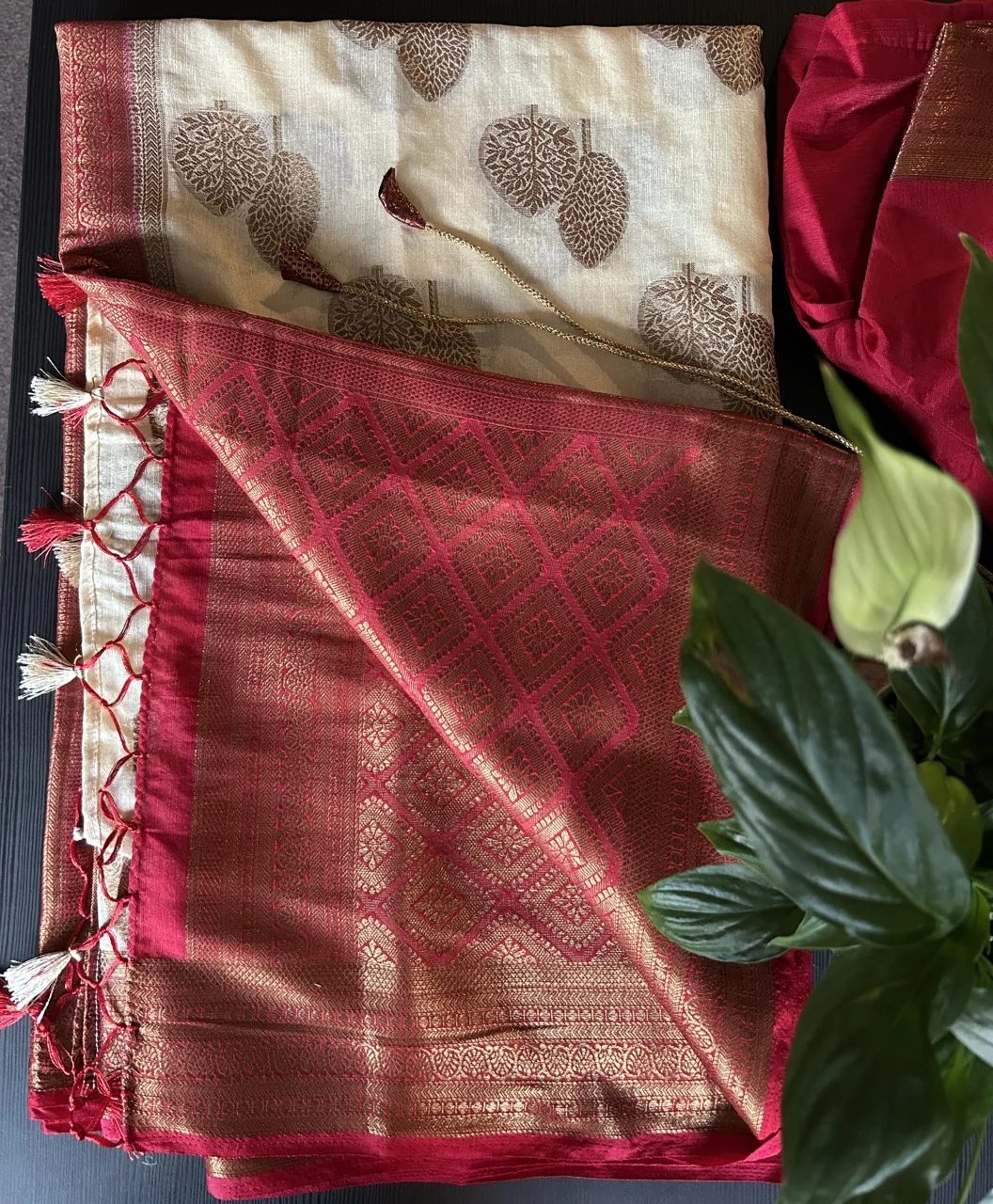 Cream and Gold Saree Featuring Tree Motifs and a Red and Gold Brocade Border with a Red Blouse