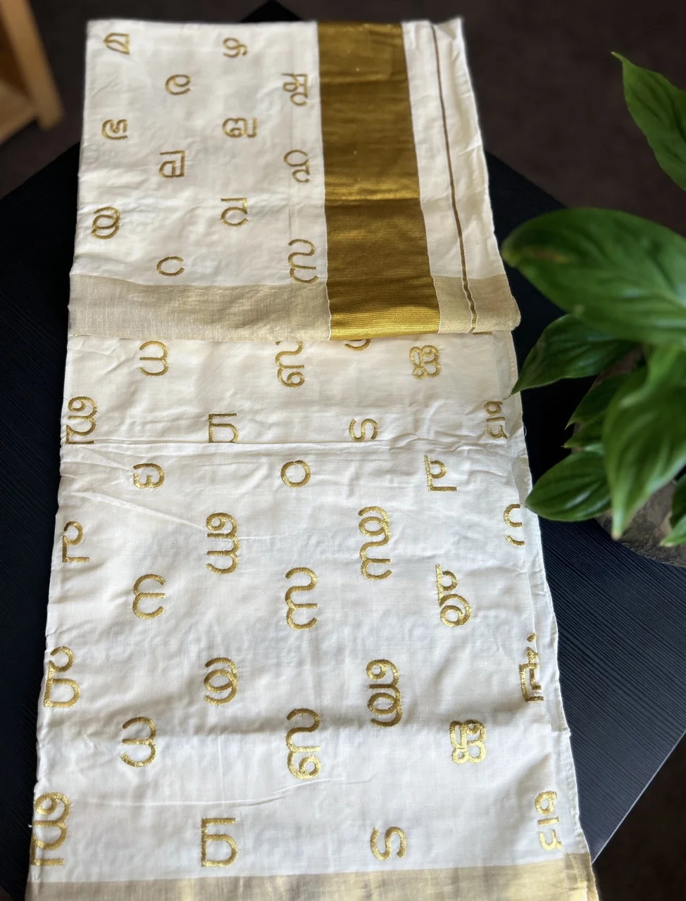 White and Gold Kerala Saree with Malayalam Script Motifs and a Matching Blouse. - Image 4