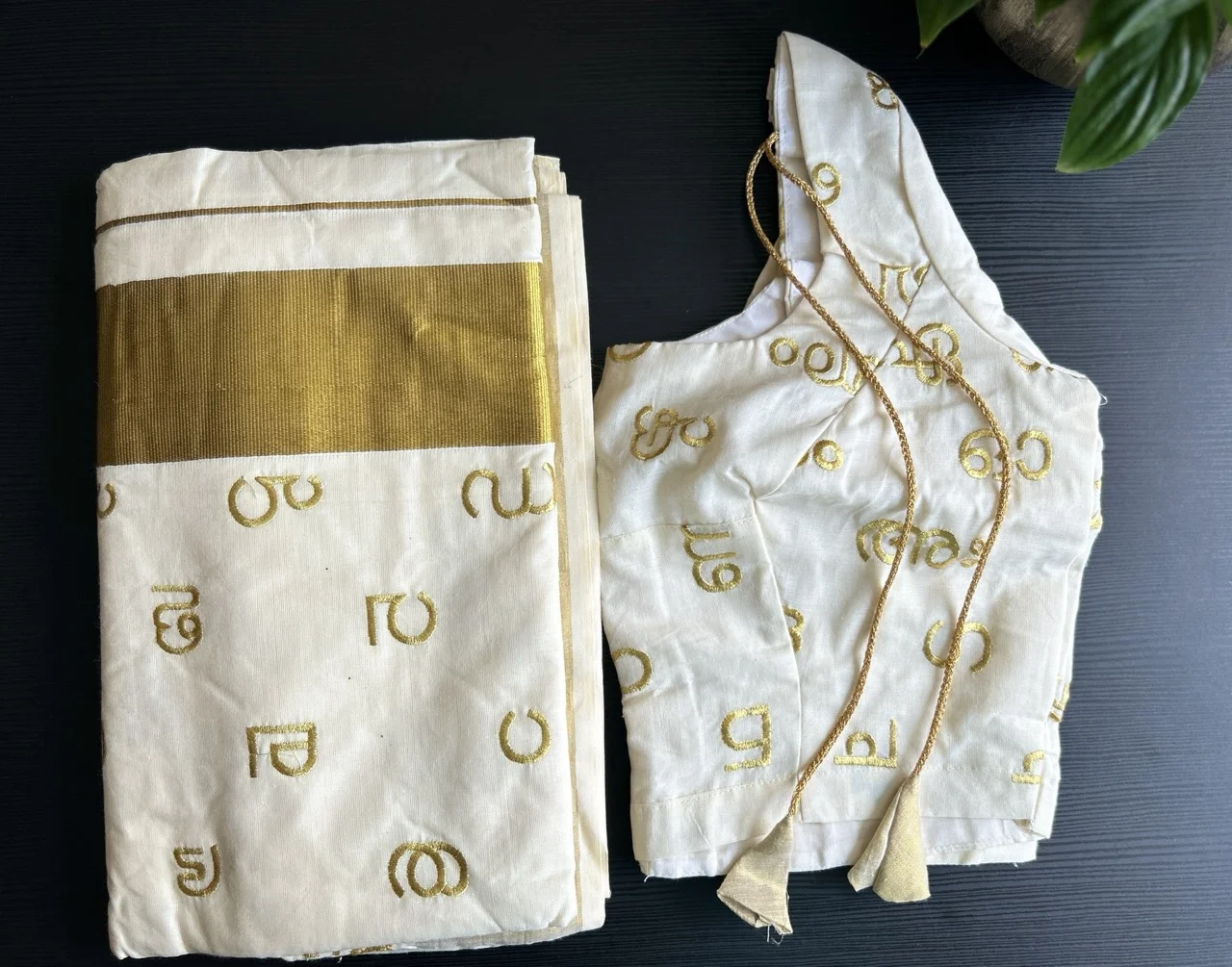 White and Gold Kerala Saree with Malayalam Script Motifs and a Matching Blouse. - Image 2