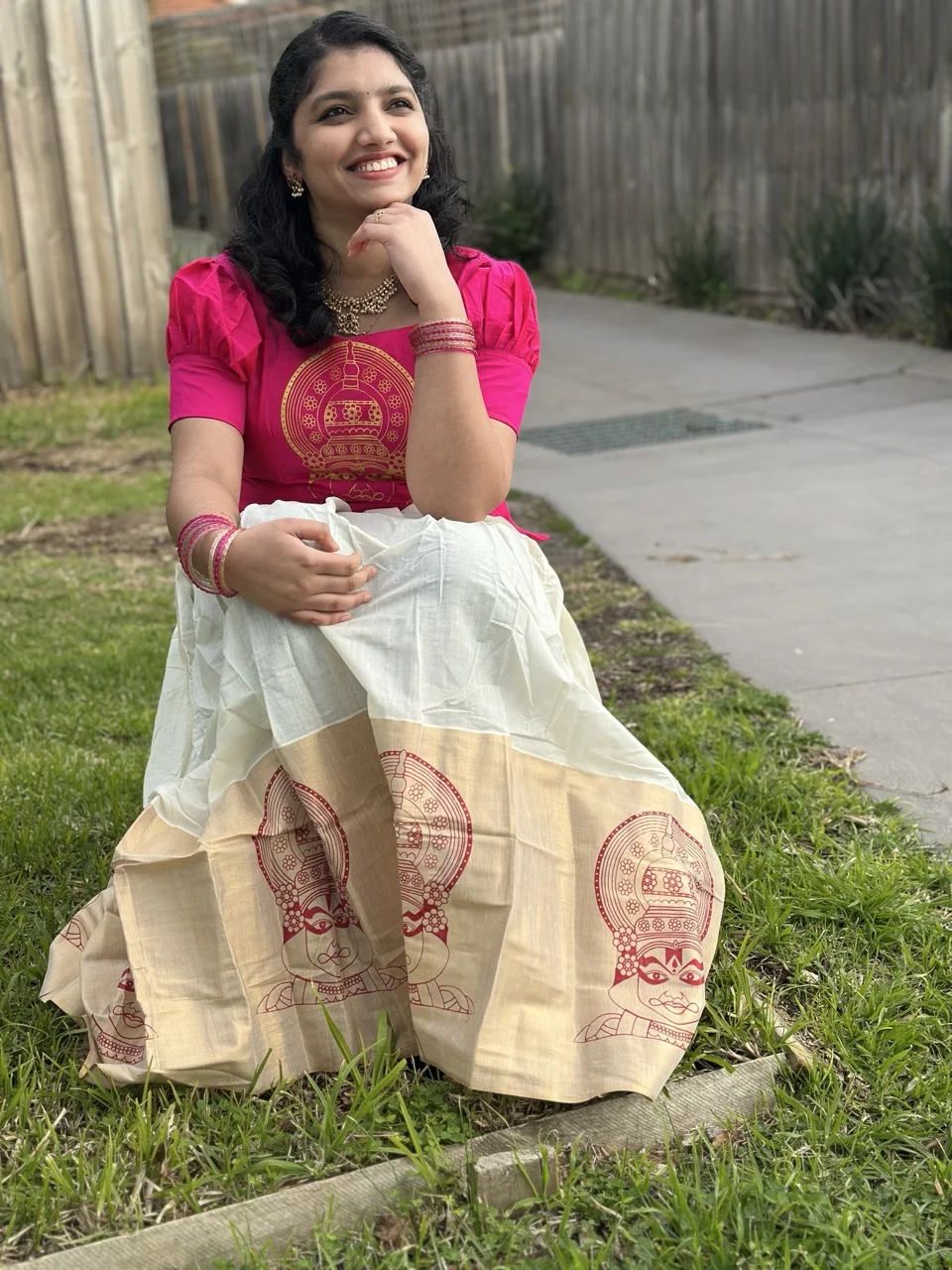 Pink Top with Gold Circular Print and White Dhavani Skirt with a Kathakali-Motif Border - Image 2