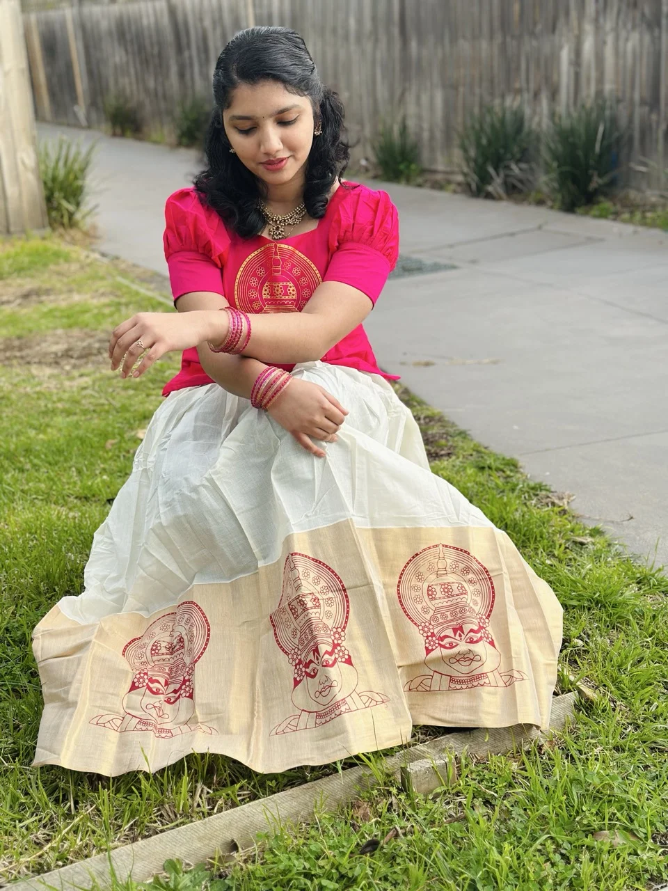 Pink Top with Gold Circular Print and White Dhavani Skirt with a Kathakali-Motif Border - Image 4